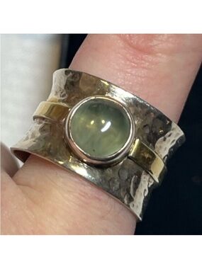 Unique sterling silver ring with green stone
Size 8